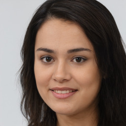 Joyful asian young-adult female with long  brown hair and brown eyes