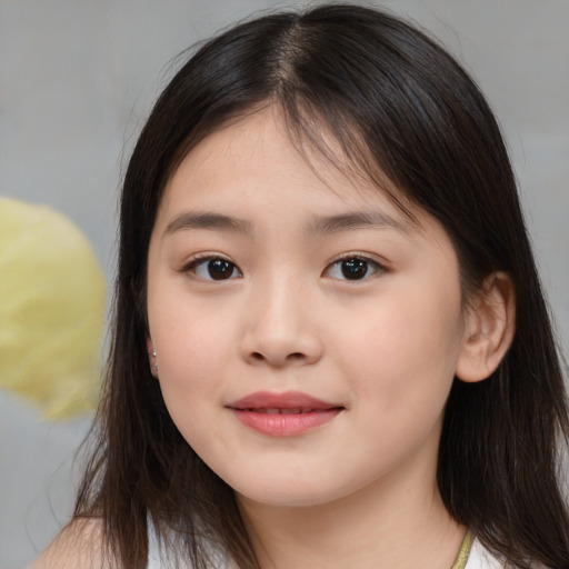 Joyful white child female with long  brown hair and brown eyes