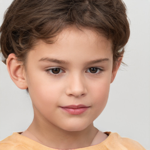 Joyful white child male with short  brown hair and brown eyes