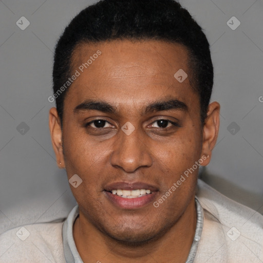 Joyful black young-adult male with short  black hair and brown eyes