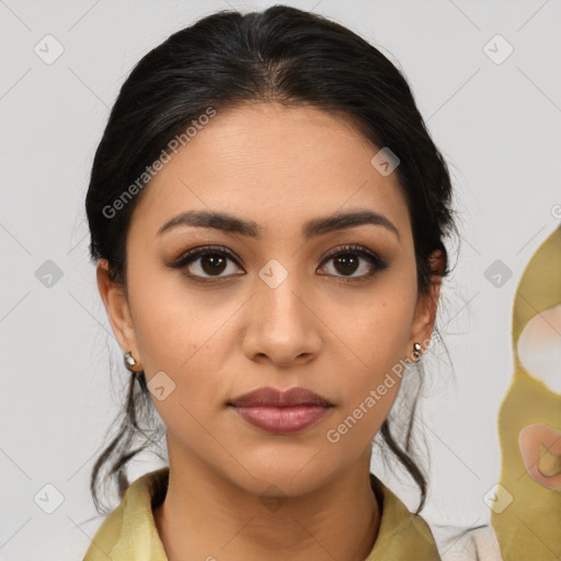 Joyful latino young-adult female with medium  brown hair and brown eyes