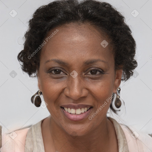 Joyful black adult female with short  brown hair and brown eyes