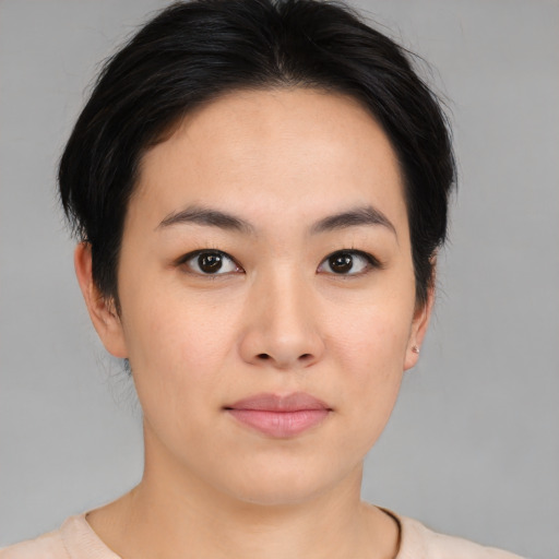 Neutral asian young-adult female with medium  black hair and brown eyes