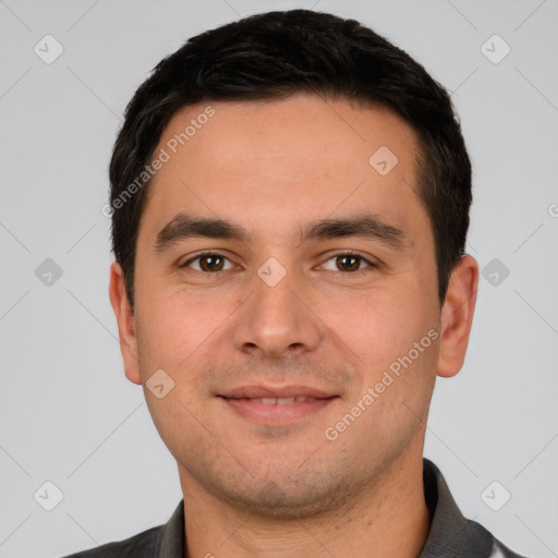 Joyful white young-adult male with short  black hair and brown eyes