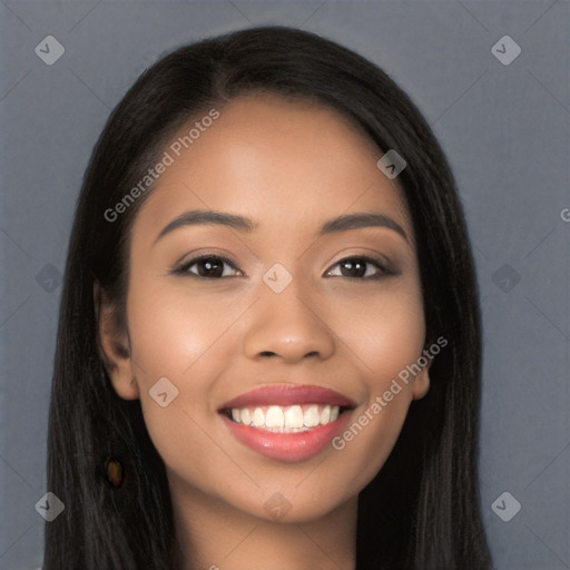 Joyful latino young-adult female with long  brown hair and brown eyes