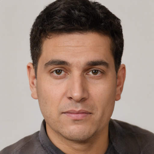 Neutral white young-adult male with short  brown hair and brown eyes