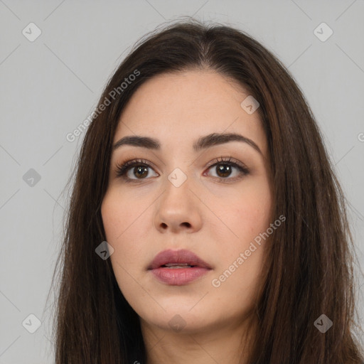 Neutral white young-adult female with long  brown hair and brown eyes