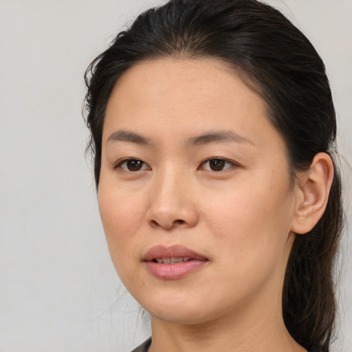 Joyful white young-adult female with medium  brown hair and brown eyes