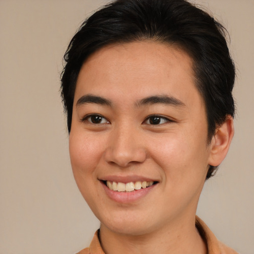 Joyful asian young-adult female with short  brown hair and brown eyes