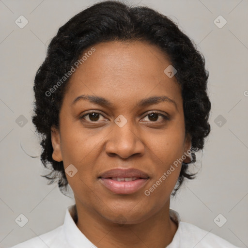 Joyful black adult female with short  brown hair and brown eyes