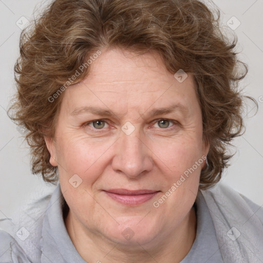 Joyful white adult female with medium  brown hair and blue eyes