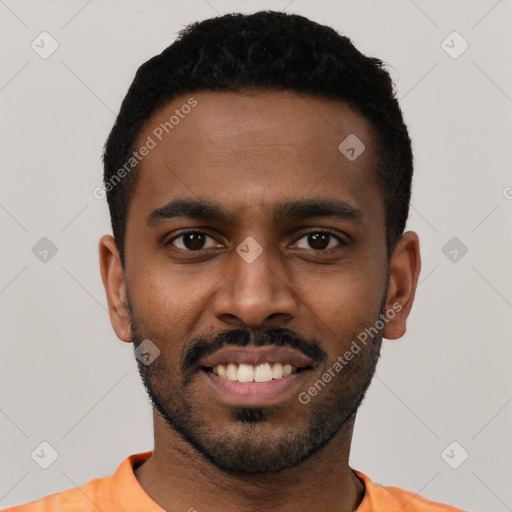 Joyful black young-adult male with short  black hair and brown eyes