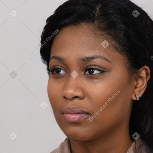 Neutral black young-adult female with long  black hair and brown eyes