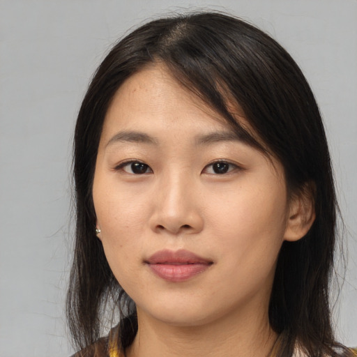 Neutral asian young-adult female with medium  brown hair and brown eyes