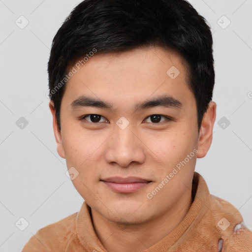 Joyful asian young-adult male with short  black hair and brown eyes