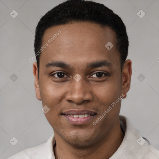 Joyful latino young-adult male with short  black hair and brown eyes