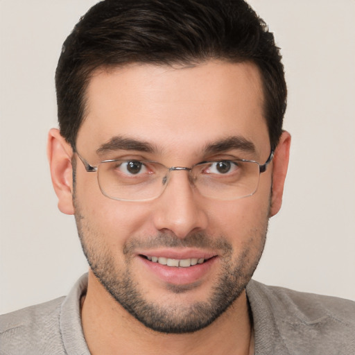 Joyful white young-adult male with short  brown hair and brown eyes