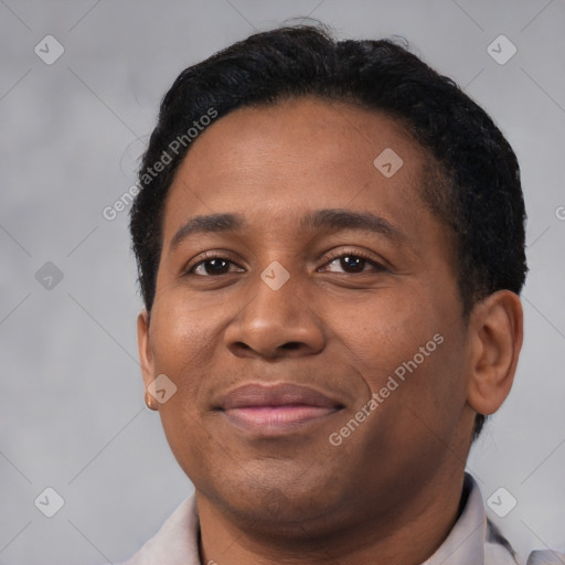 Joyful latino adult male with short  black hair and brown eyes