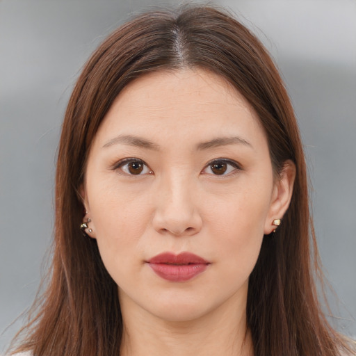 Neutral white young-adult female with long  brown hair and brown eyes