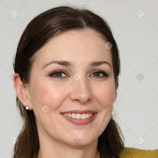 Joyful white adult female with medium  brown hair and grey eyes