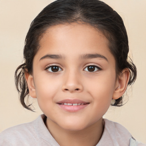 Joyful white child female with medium  brown hair and brown eyes