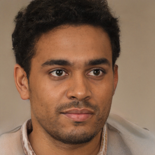 Neutral latino young-adult male with short  brown hair and brown eyes
