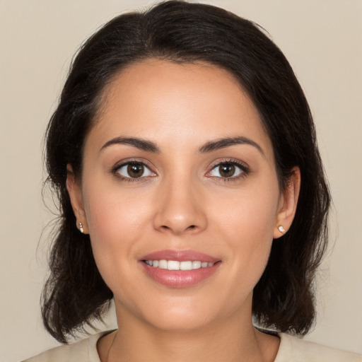 Joyful white young-adult female with medium  brown hair and brown eyes