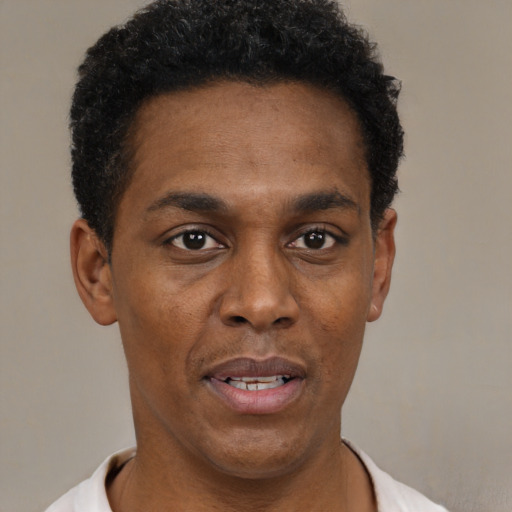 Neutral black adult male with short  black hair and brown eyes