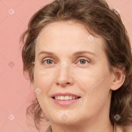 Joyful white young-adult female with medium  brown hair and green eyes