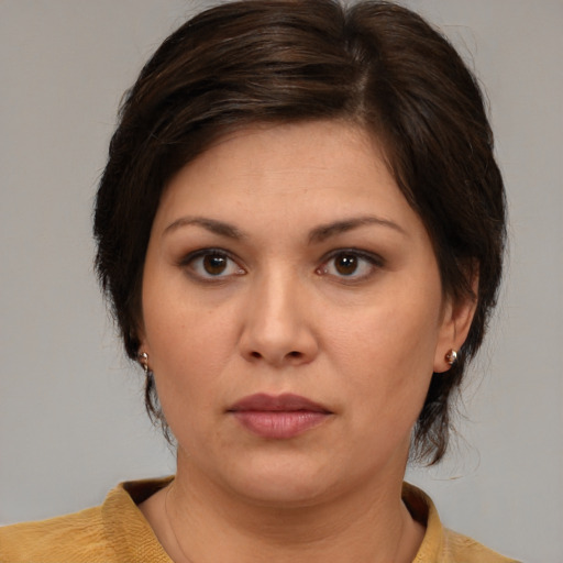 Neutral white young-adult female with medium  brown hair and brown eyes