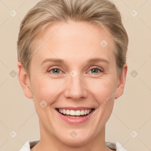 Joyful white young-adult female with short  brown hair and grey eyes