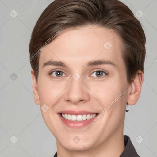 Joyful white young-adult female with short  brown hair and grey eyes