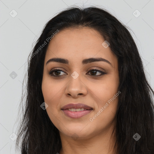 Joyful latino young-adult female with long  brown hair and brown eyes