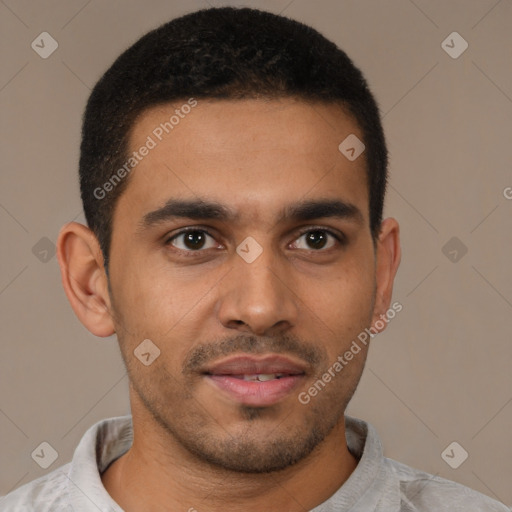 Joyful latino young-adult male with short  brown hair and brown eyes