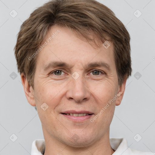 Joyful white adult male with short  brown hair and grey eyes