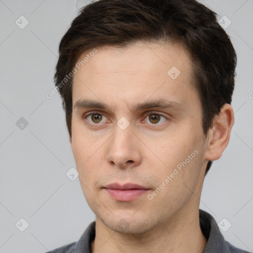 Neutral white young-adult male with short  brown hair and brown eyes