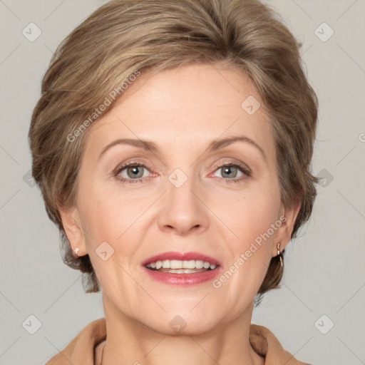 Joyful white adult female with medium  brown hair and grey eyes