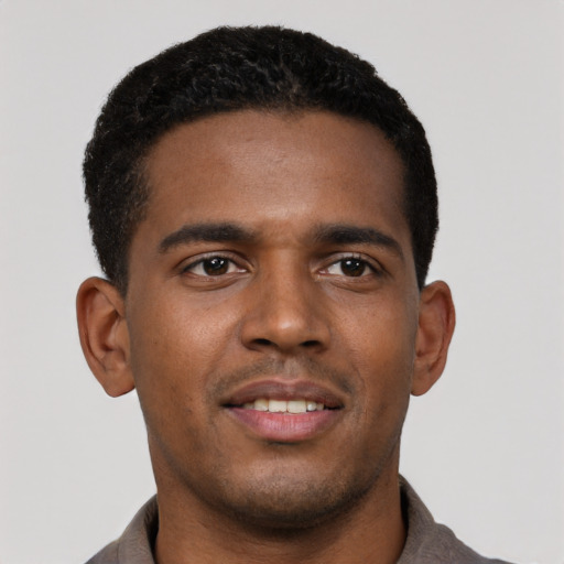 Neutral black young-adult male with short  black hair and brown eyes