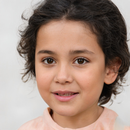 Joyful white child female with medium  brown hair and brown eyes