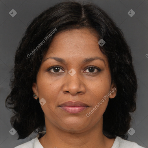 Joyful black adult female with medium  brown hair and brown eyes