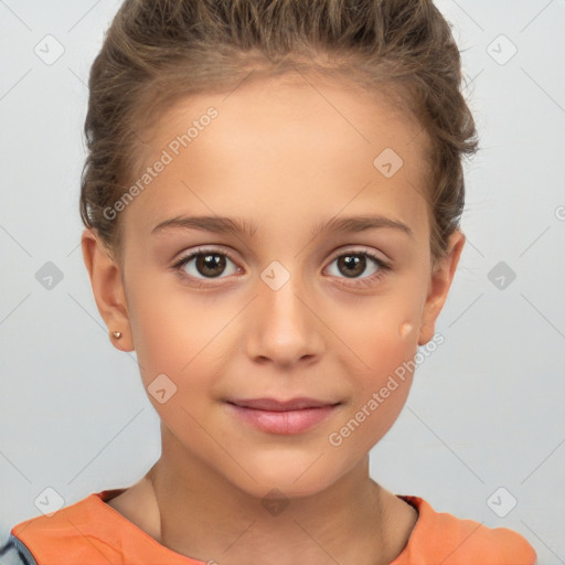 Joyful white child female with short  brown hair and brown eyes