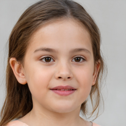 Joyful white child female with medium  brown hair and brown eyes