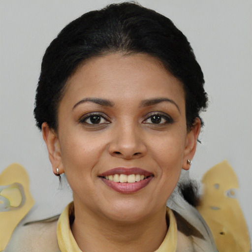 Joyful latino young-adult female with short  brown hair and brown eyes