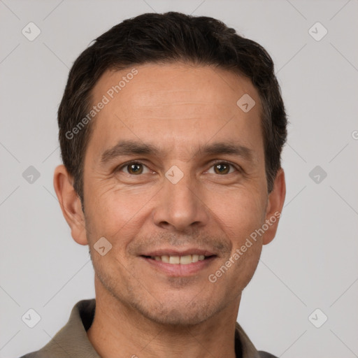 Joyful white adult male with short  brown hair and brown eyes