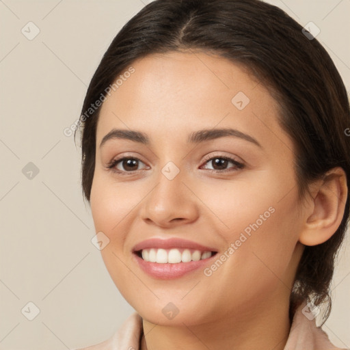 Joyful white young-adult female with long  brown hair and brown eyes