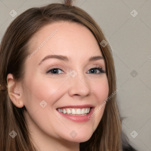 Joyful white young-adult female with long  brown hair and grey eyes