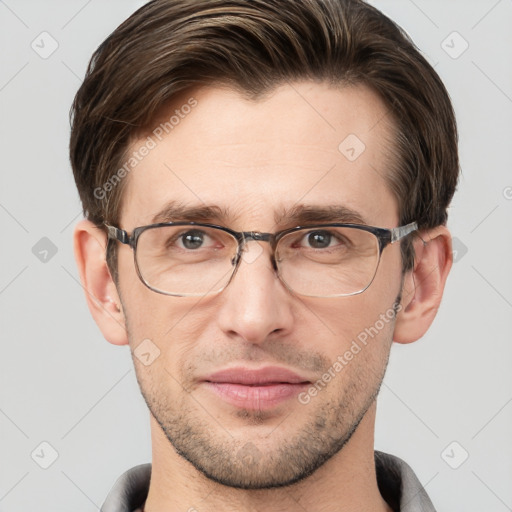 Joyful white young-adult male with short  brown hair and grey eyes