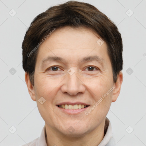 Joyful white adult male with short  brown hair and brown eyes