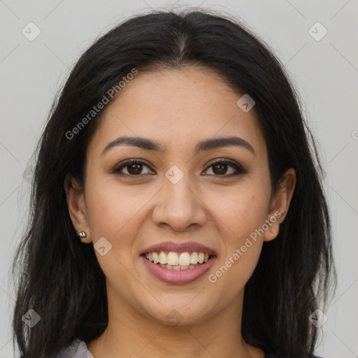 Joyful latino young-adult female with long  brown hair and brown eyes