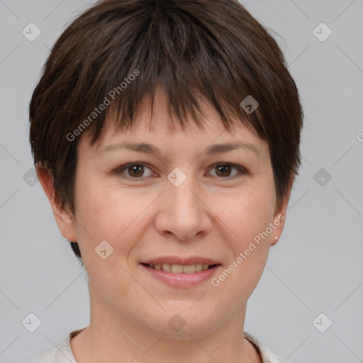 Joyful white adult female with short  brown hair and brown eyes